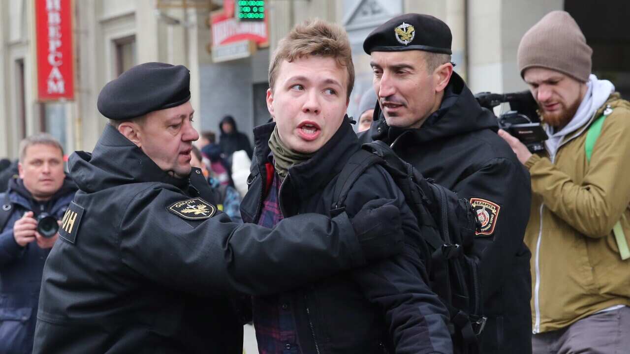 Police officers detain journalist Roman Protasevich attempting to cover a rally in Minsk, Belarus on 26 March 2017 (reissued 23 May 2021).