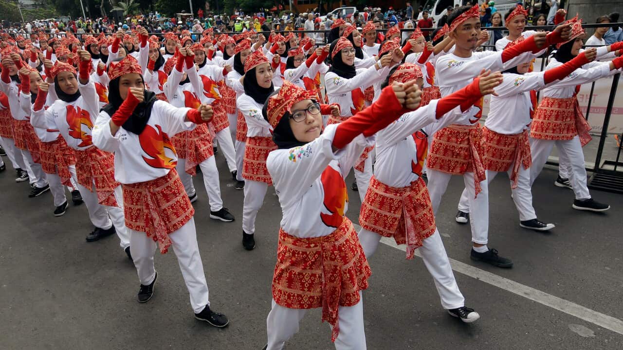Indonesian students perform the Poco-Poco dance in an attempt to break the Guinness World Record.