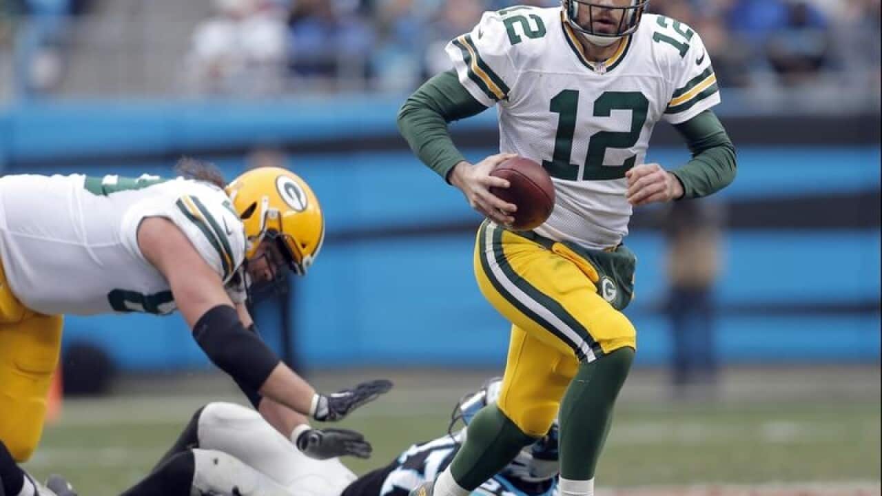 Aaron Rodgers scrambles against the Carolina Panthers