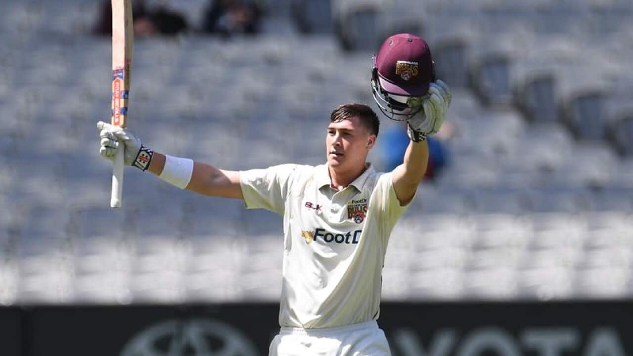 Queensland batsman Matt Renshaw celebrates after scoring a century