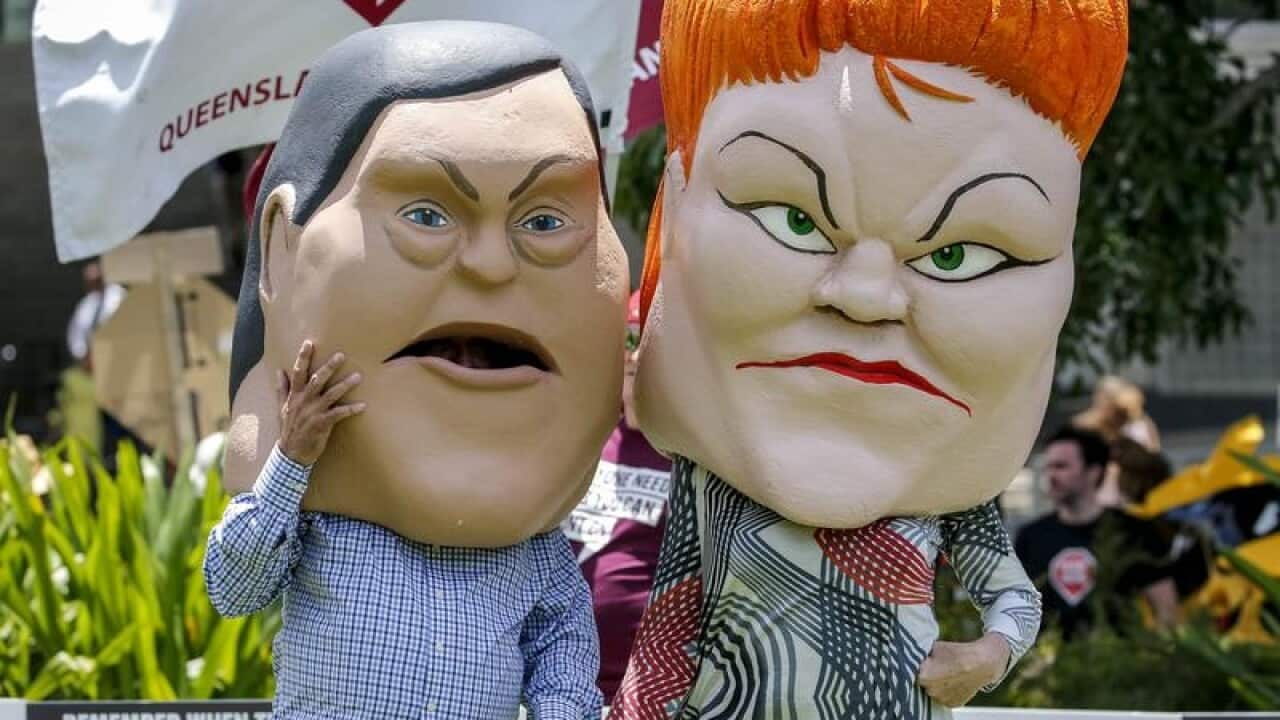 Protestors dressed as caricatures of Tim Nicholls and Pauline Hanson.