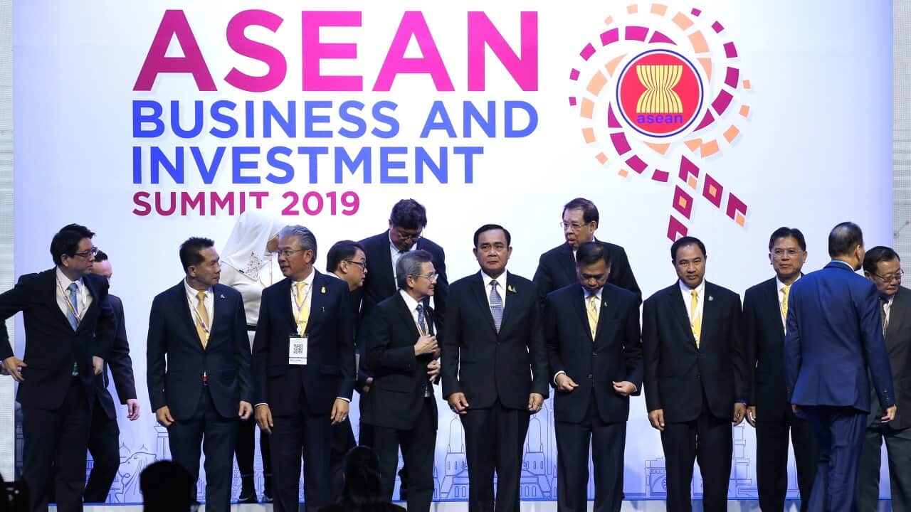 Thailand's Prime Minister Prayut Chan-o-cha (C) poses for a group photo with attendees during the opening ceremony of ASEAN Business and Investment Summit 2019.