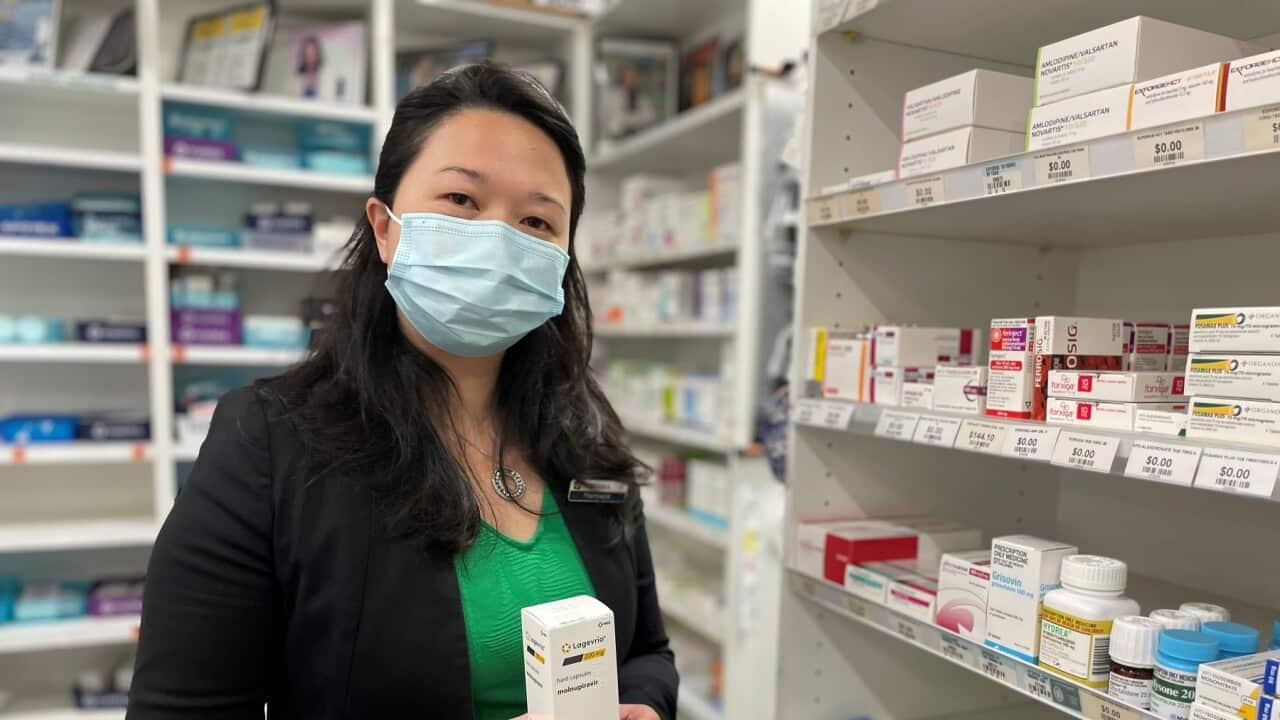 Veronica Nou with some of the antiviral drugs available (SBS-Lucy Murray).jpg