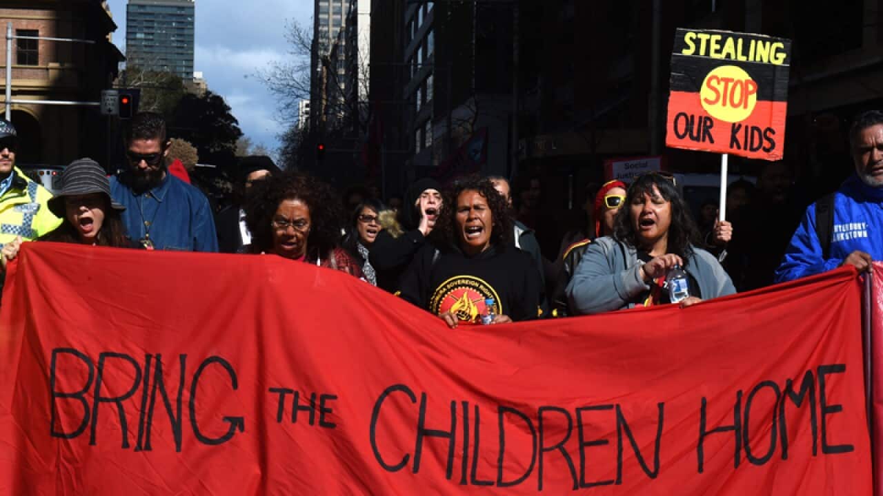 Demonstrators protesting an Aboriginal Children's Day Rally