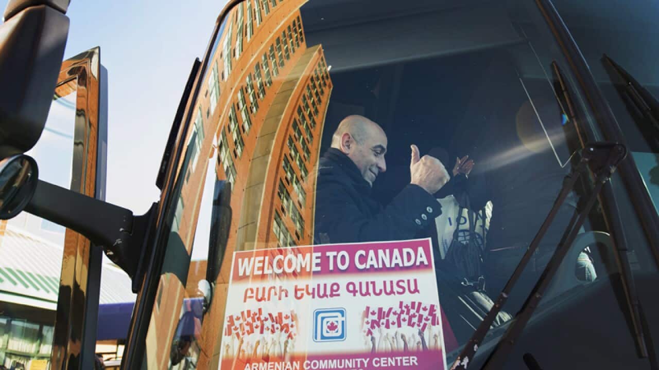 A Syrian refugee after arriving in Toronto