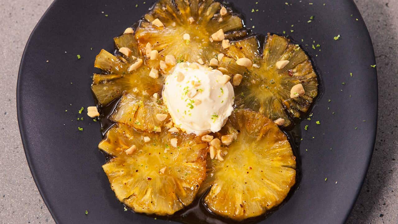 Glazed pineapple with salted peanuts and coconut ice-cream