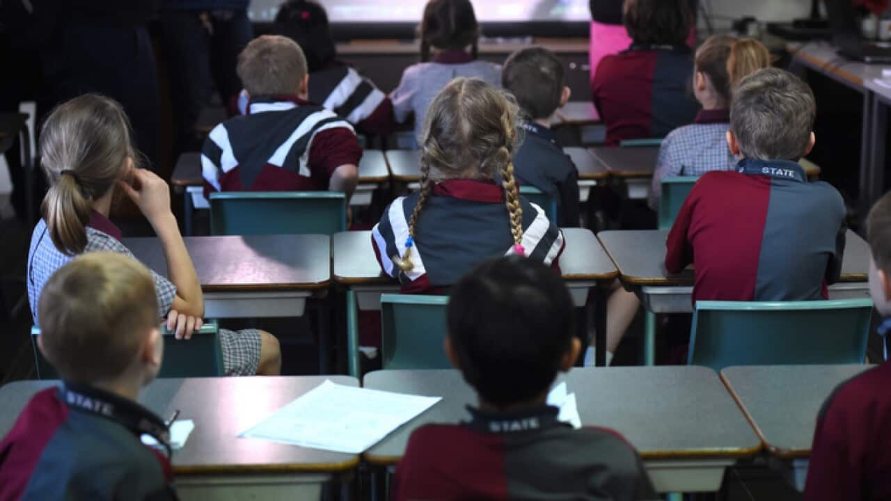 Children sit in a classroom during a lesson in Brisbane.