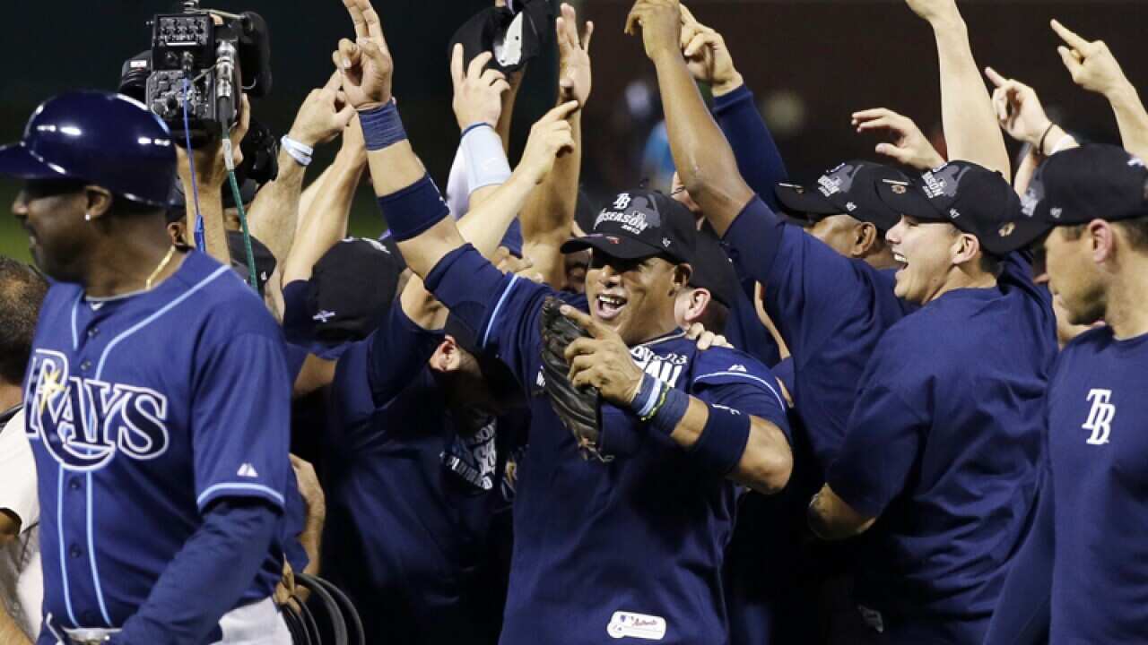 The Tampa Bay Rays celebrate after beating the Texas Rangers