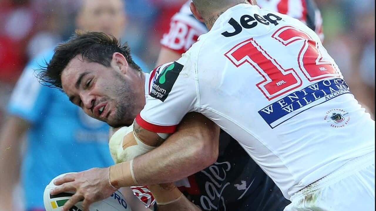 Aiden Guerr reacts to a shoulder tackle from Joel Thompson.