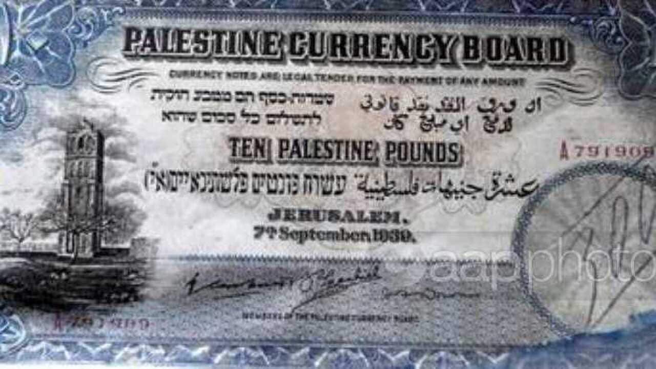 A Palestinian currency Ten Palestine pounds note that was issued in Jerusalem 07 Septemper 1939 is displayed during an exhibition to commemorate the Palestinian heritage on the occasion of the Palestinian heritage day that comes across.