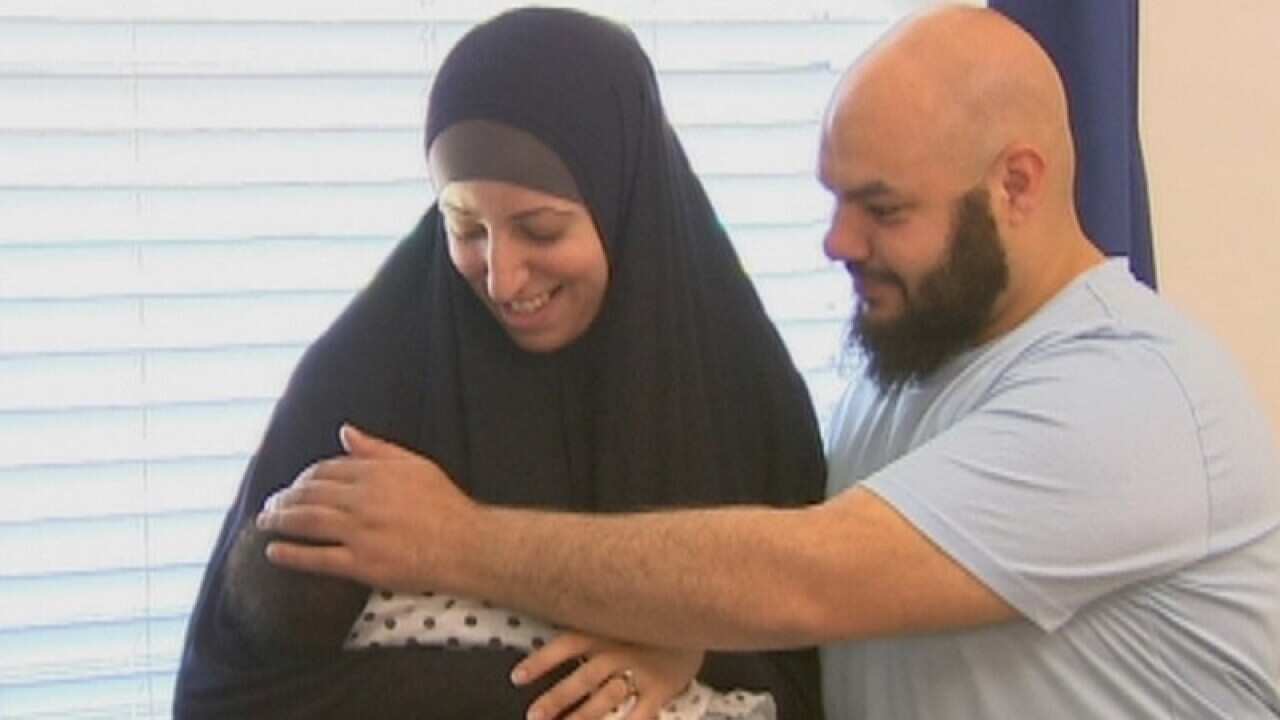 Foster parents Samar, left, and Mo