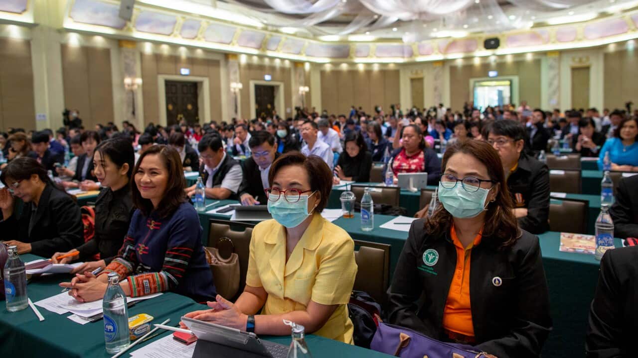 Public health officials participate in a preparation meeting for coronavirus