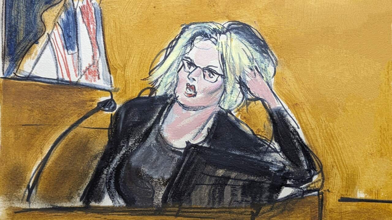 A courtroom sketch of a woman wearing glasses