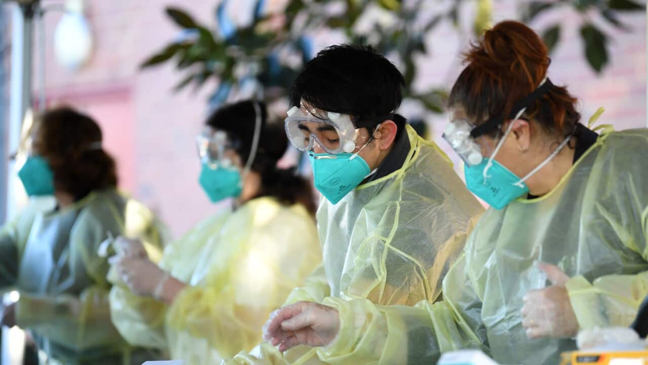 A file photo of healthcare workers administering COVID-19 Rapid Antigen tests on Campus at Firbank Grammar School in Brighton, Melbourne.