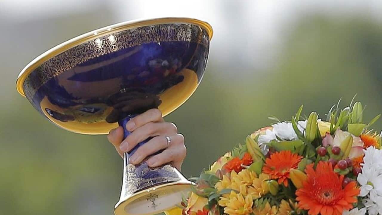 Chris Froome celebrates with the Tour De France trophy