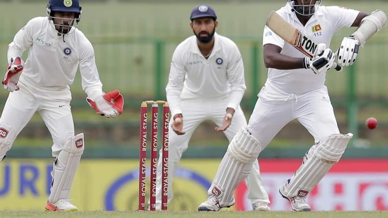 Sri Lanka's Angelo Mathews, right