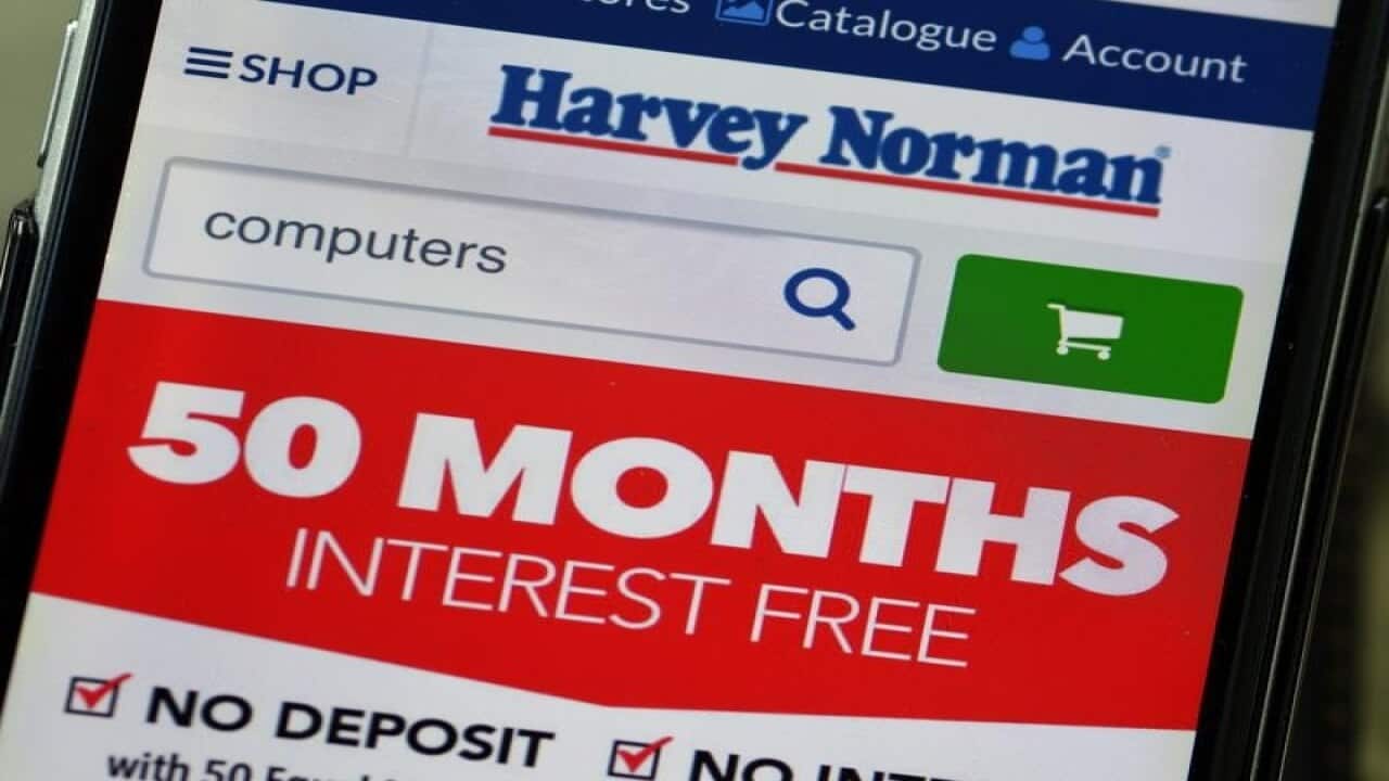 Harvey Norman website is seen on a phone