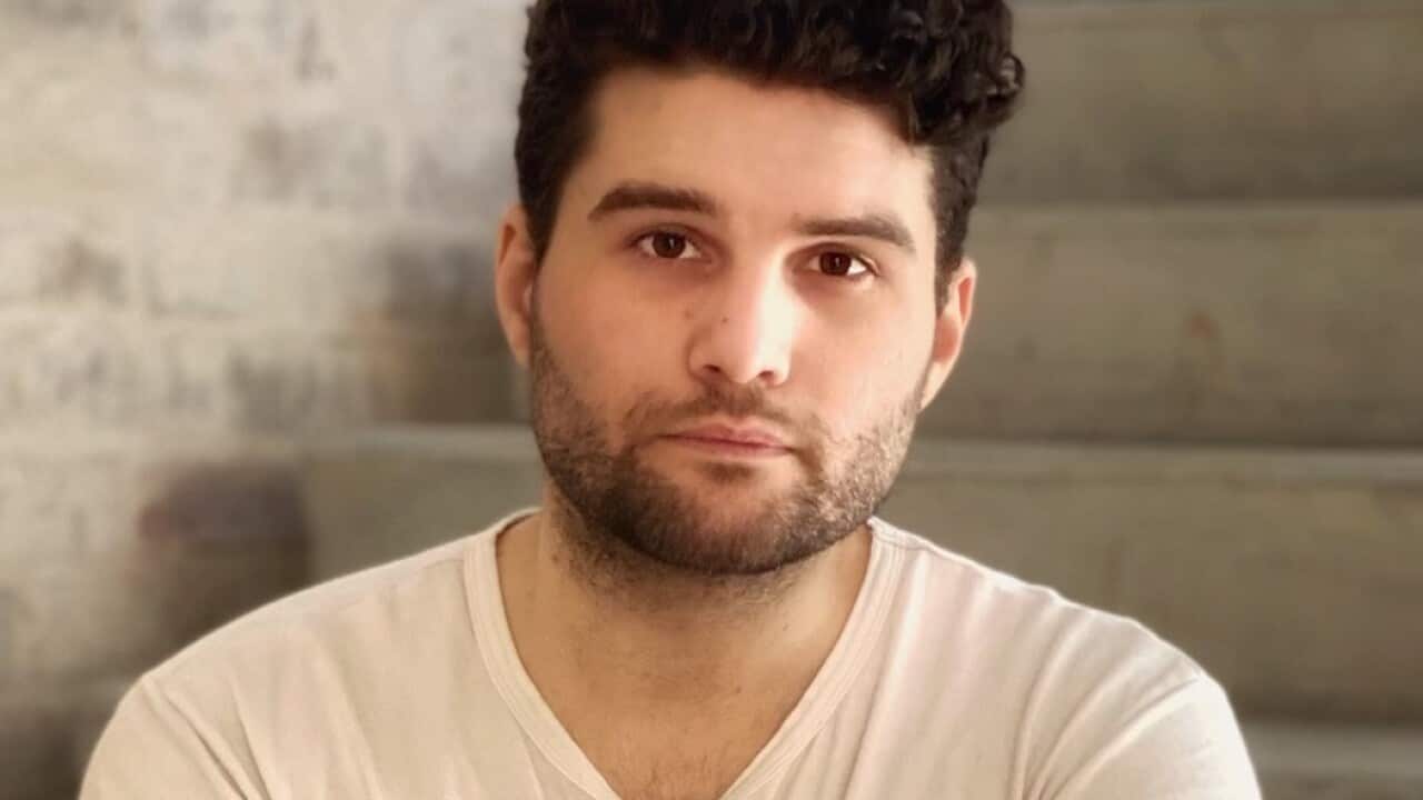 Man sitting on stairs.