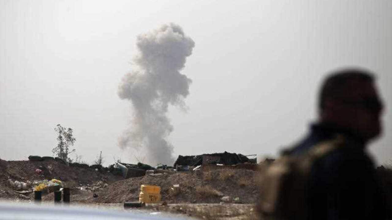 Smoke rises from a car bomb by Islamic State group on the front line in Fallujah, Iraq, Sunday, June 5, 2016.