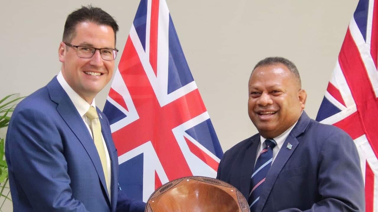 Fiji's Acting Foreign Affairs Minister Inia Seruiratu (right) welcomes Australia’s Minister for International Development and the Pacific Zed Seselja.