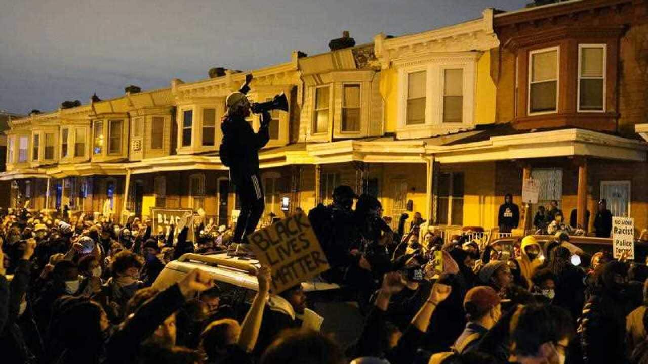 Protesters confront police during a march on 27 October in Philadelphia.
