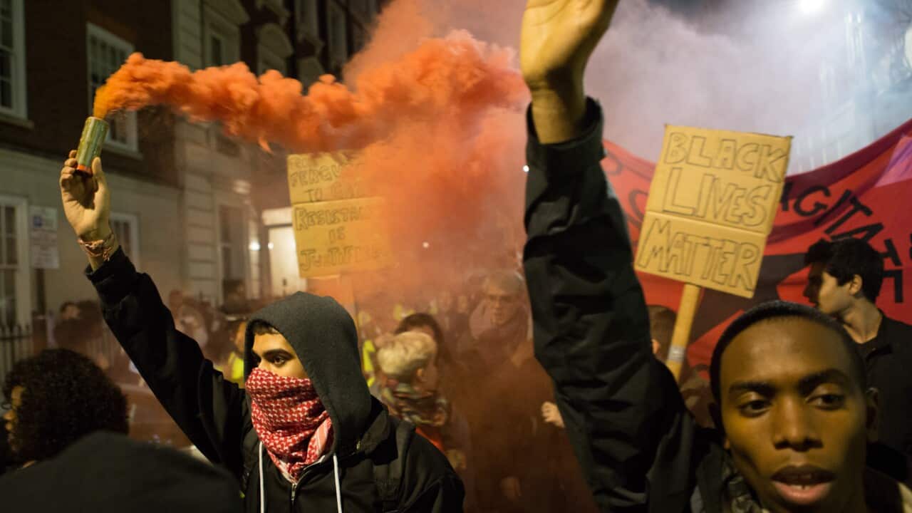 Flares lit up London streets outside the US embassy in solidarity with Ferguson 