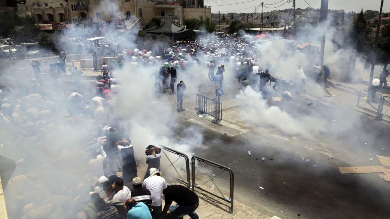 An escalating dispute over metal detectors at a contested Jerusalem shrine turned violent on Friday, setting off widespread clashes between Palestinian stone-th