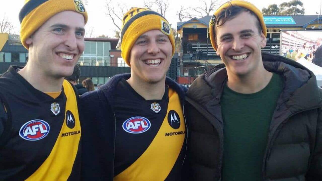 The Flicker brothers, from left Tim, Rob and Tom, celebrate Richmond another premiership in 2019.