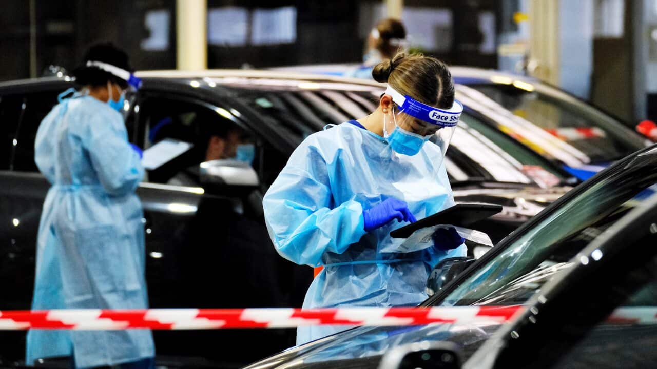 Health workers conduct COVID-19 testing at the Montague St centre in South Melbourne.