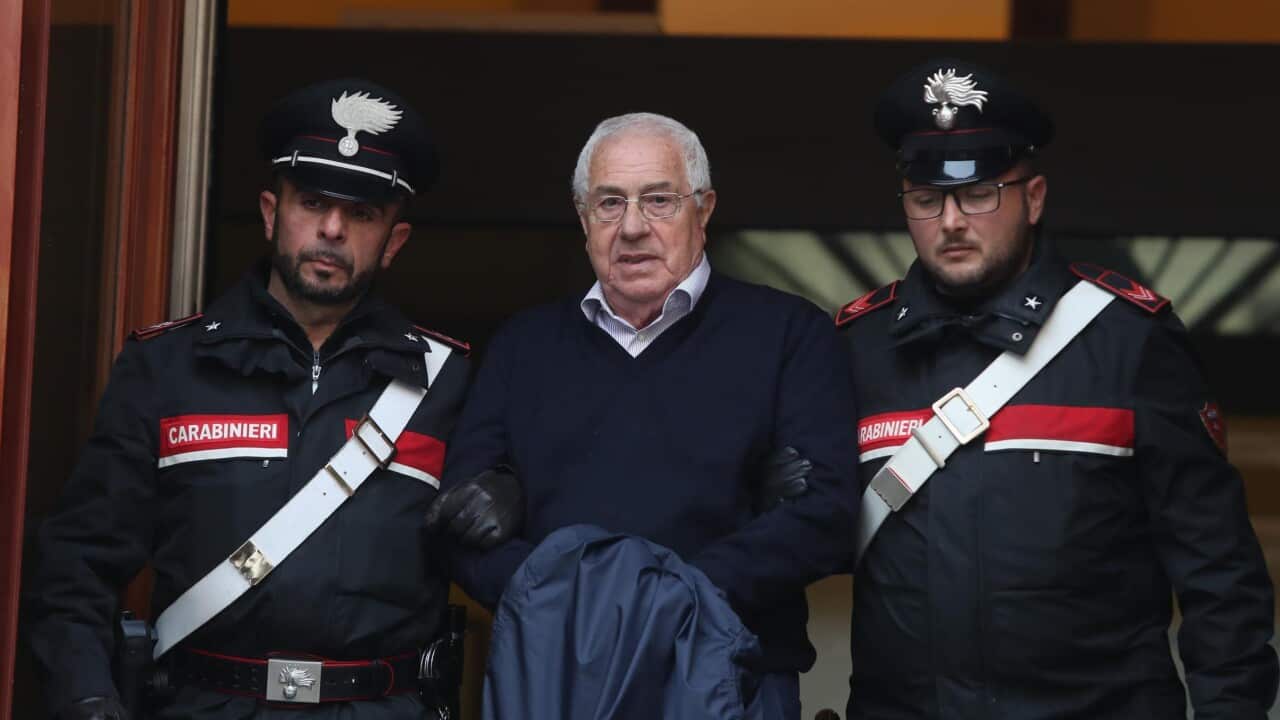 Settimino Mineo, center, who allegedly took over as the Palermo head of Cosa Nostra, is escorted by Italian Carabinieri police after an anti Mafia operation which led the arrest of 46 people.