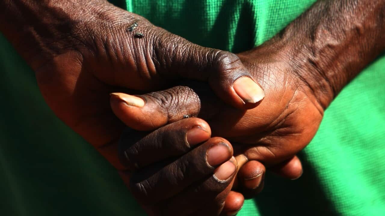 Woman holds her hands in front of her