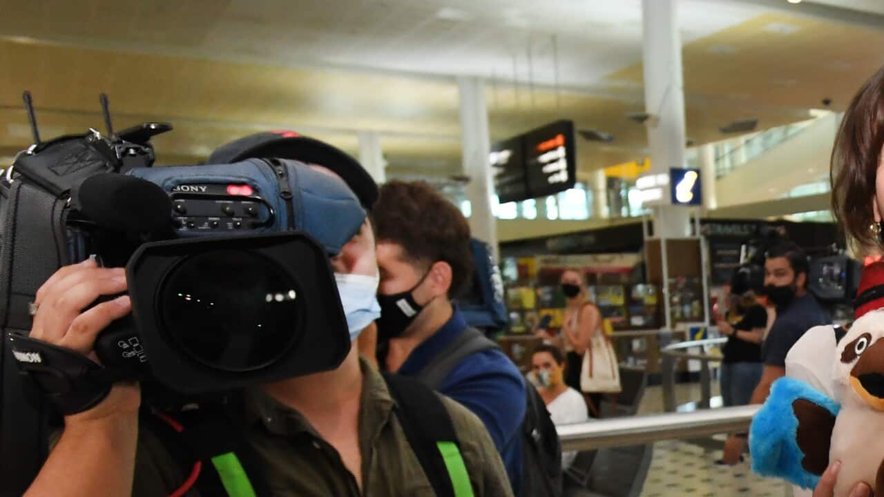 Chantal Ebbinge (centre) from the Netherlands arriving at Brisbane International Airport. Monday, February 21, 2022.
