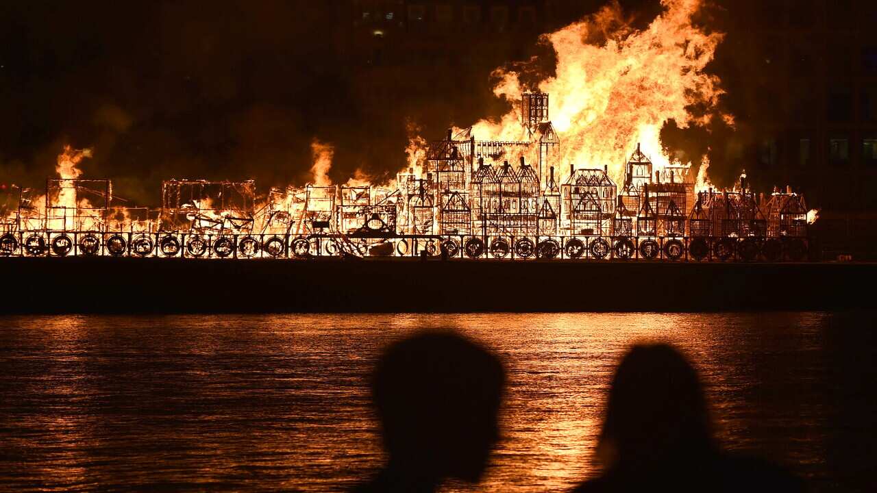 A 120-metre long model of London's sky line in the 17th Century is set alight on the River Thames in London.