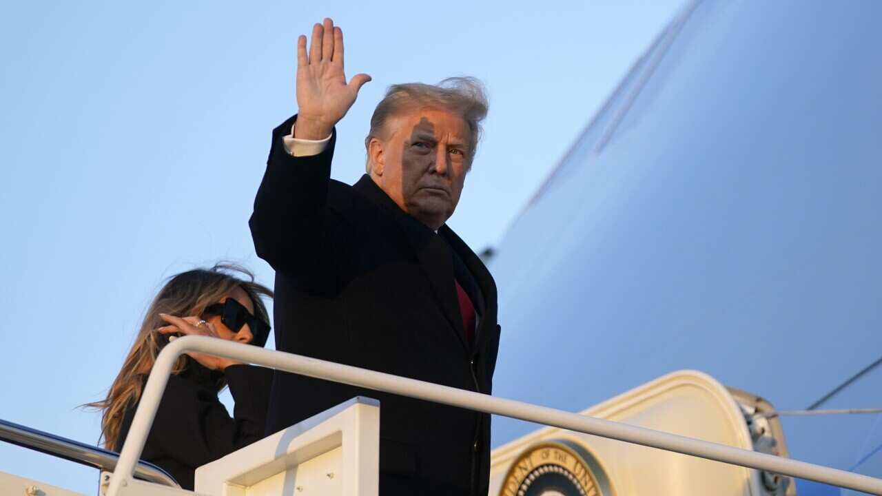 President Donald Trump waves as he boards Air Force One at Andrews Air Force Base, Md., Wednesday, Dec. 23, 2020. Trump is traveling to his Mar-a-Lago resort in Palm Beach, Fla. (AP Photo/Patrick Semansky)