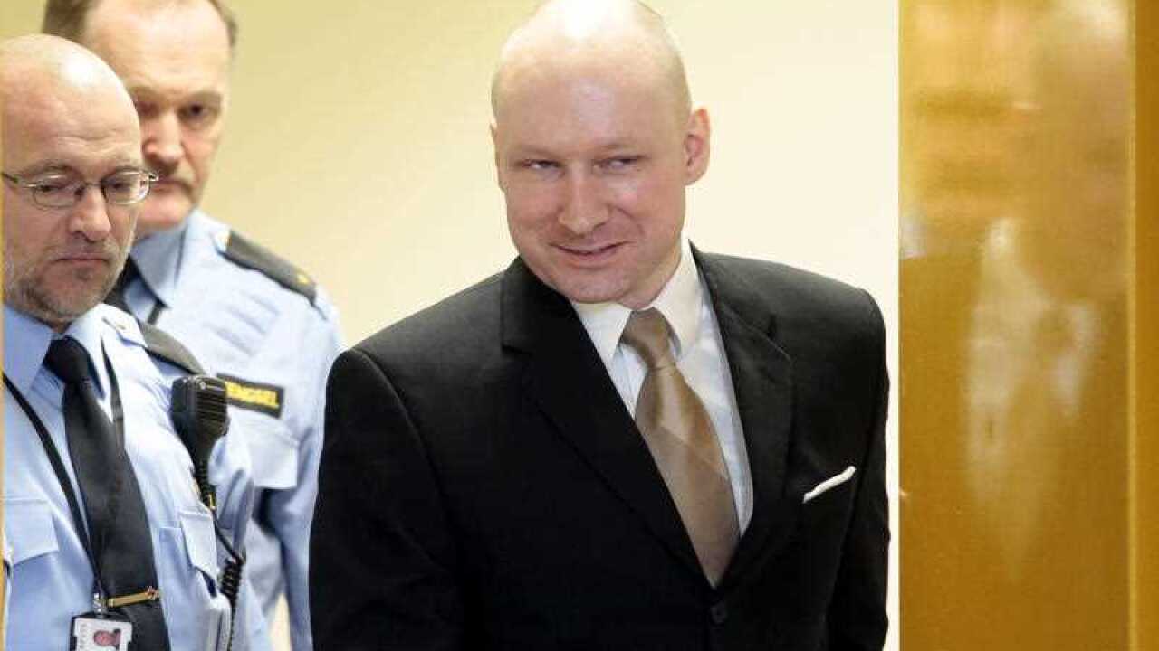 Anders Behring Breivik enters a courtroom in Skien, Norway, on Tuesday, March 15, 2016.