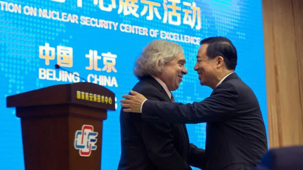 U.S. Secretary of Energy Ernest Moniz, left and Chairman Xu Dazhe of the Chinese Atomic Energy Authority greets each other.