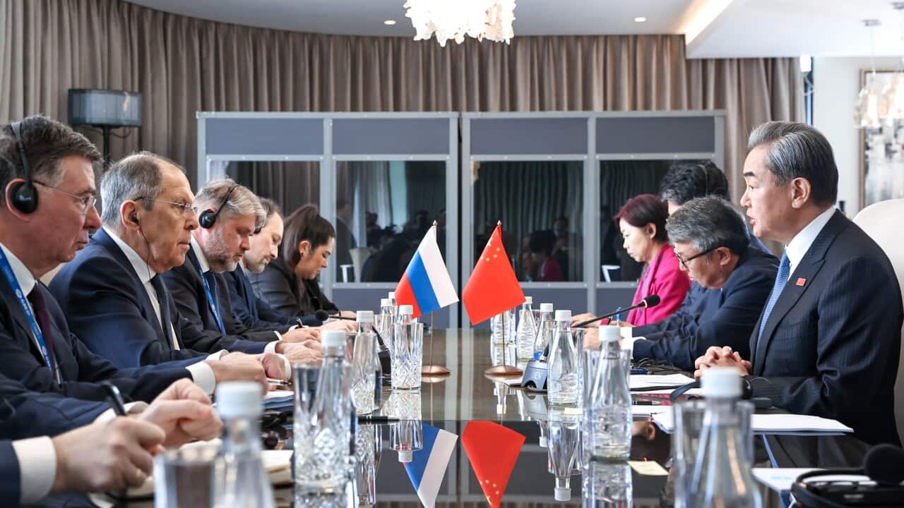 Russia’s Minister of Foreign Affaris Sergei Lavrov (2nd L) and China's Minister of Foreign Affairs Wang Yi (R) meet for talks on the sidelines of a G20 foreign ministers' meeting as part of the G20 South Africa Summit.