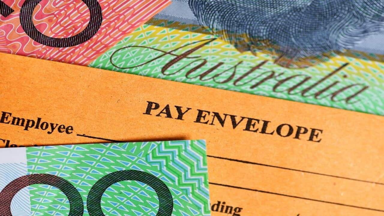 Australian currency and a wages envelope