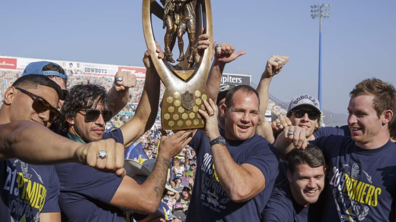 North Queensland Cowboys players celebrate with the NRL premiership