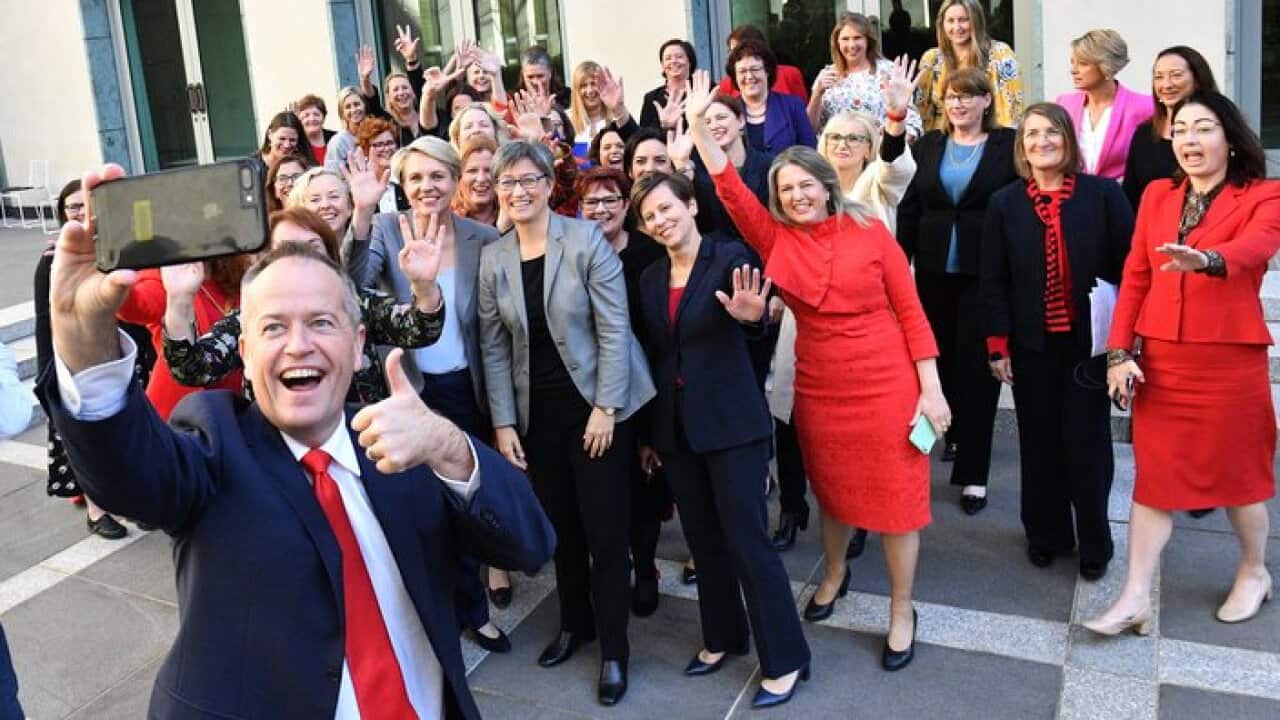 Leader of the Opposition Bill Shorten takes a selfie with female members of the Labor party