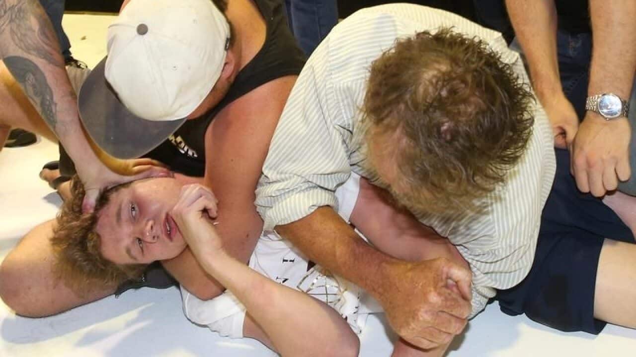 Will Connolly was restrained by Fraser Anning supporters after he egged the senator.