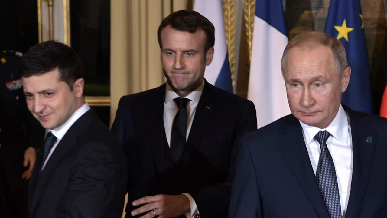 Ukrainian President Volodymyr Zelensky (L), French President Emmanuel Macron (C) and Russian President Vladimir Putin (R)