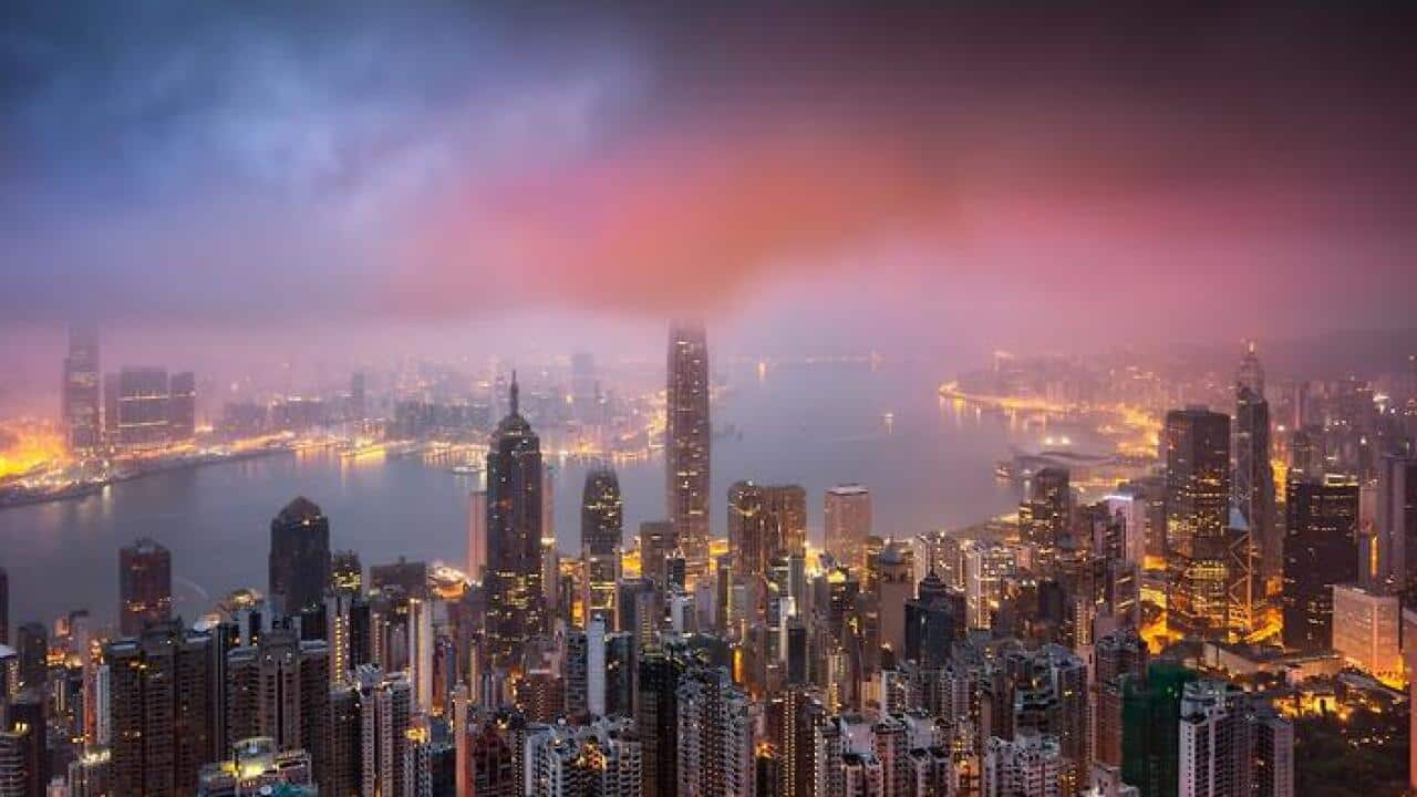 Night view of skyscrapers and high-rise buildings in Central along the Victoria Harbor in Hong Kong, China, 17 April 2017. (AAP)