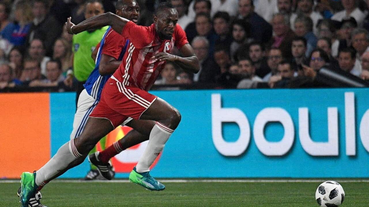 Jamaican athlete Usain Bolt plays in a friendly between French 1998 World Champion soccer players and an international selection in June 2018