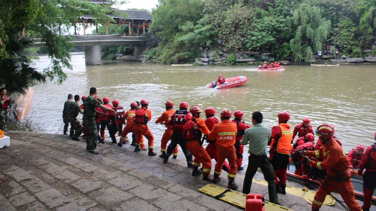 The rescue for bodies continues in the Taohua River.