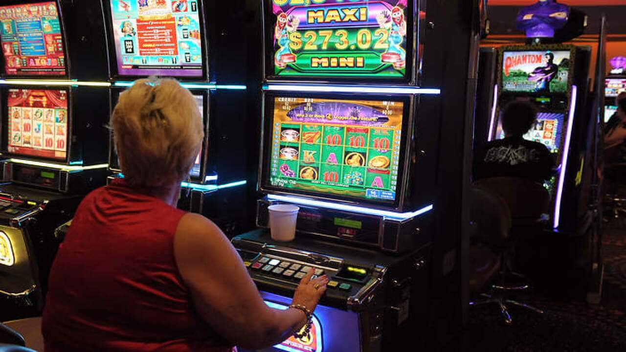 A woman on a poker machine