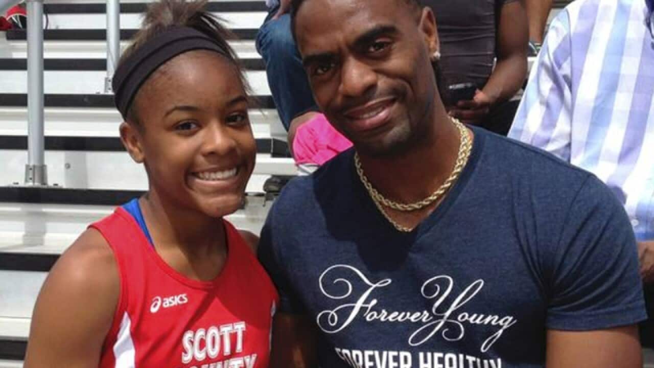 Trinity Gay poses for a photo with her father Tyson Gay
