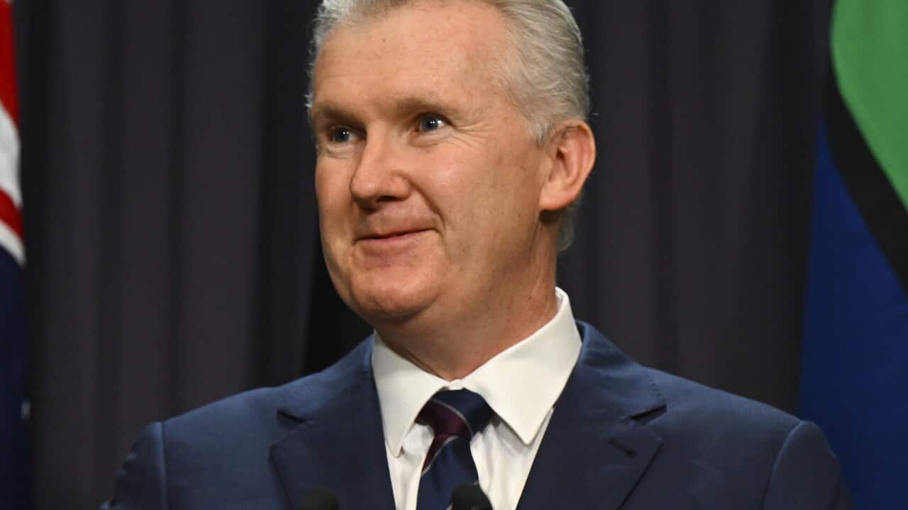 A man speaking at a podium.