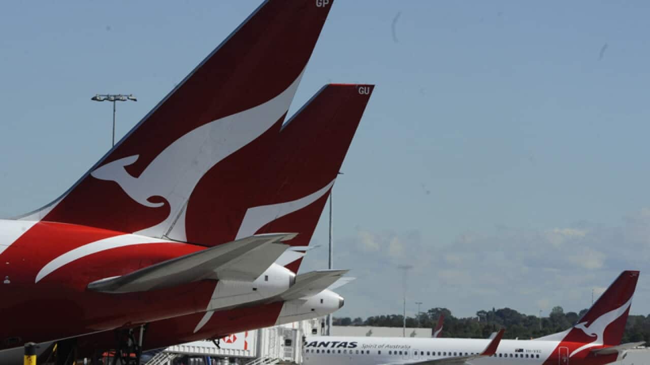 Qantas planes are seen on the tarmac at Sydney Airport