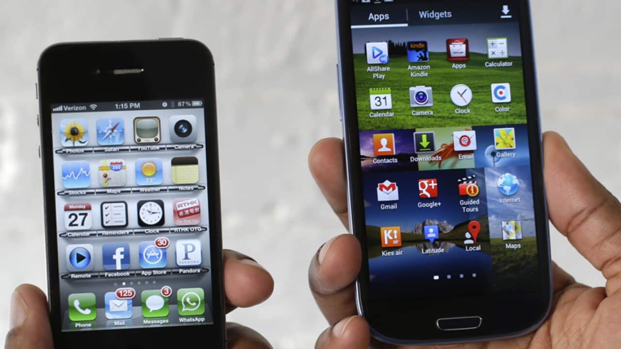 The Apple iPhone 4S (L) and the Samsung Galaxy S III